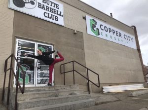 Standing bow in front of local business