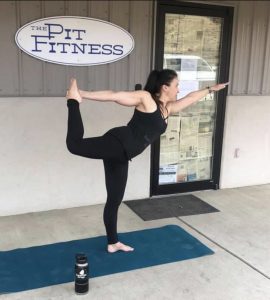 Standing Bow in front of local business