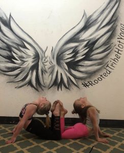 King Cobra Pose In Front of Wings Mural