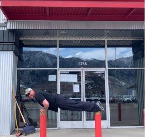 Plank balanced on poles outside of local business